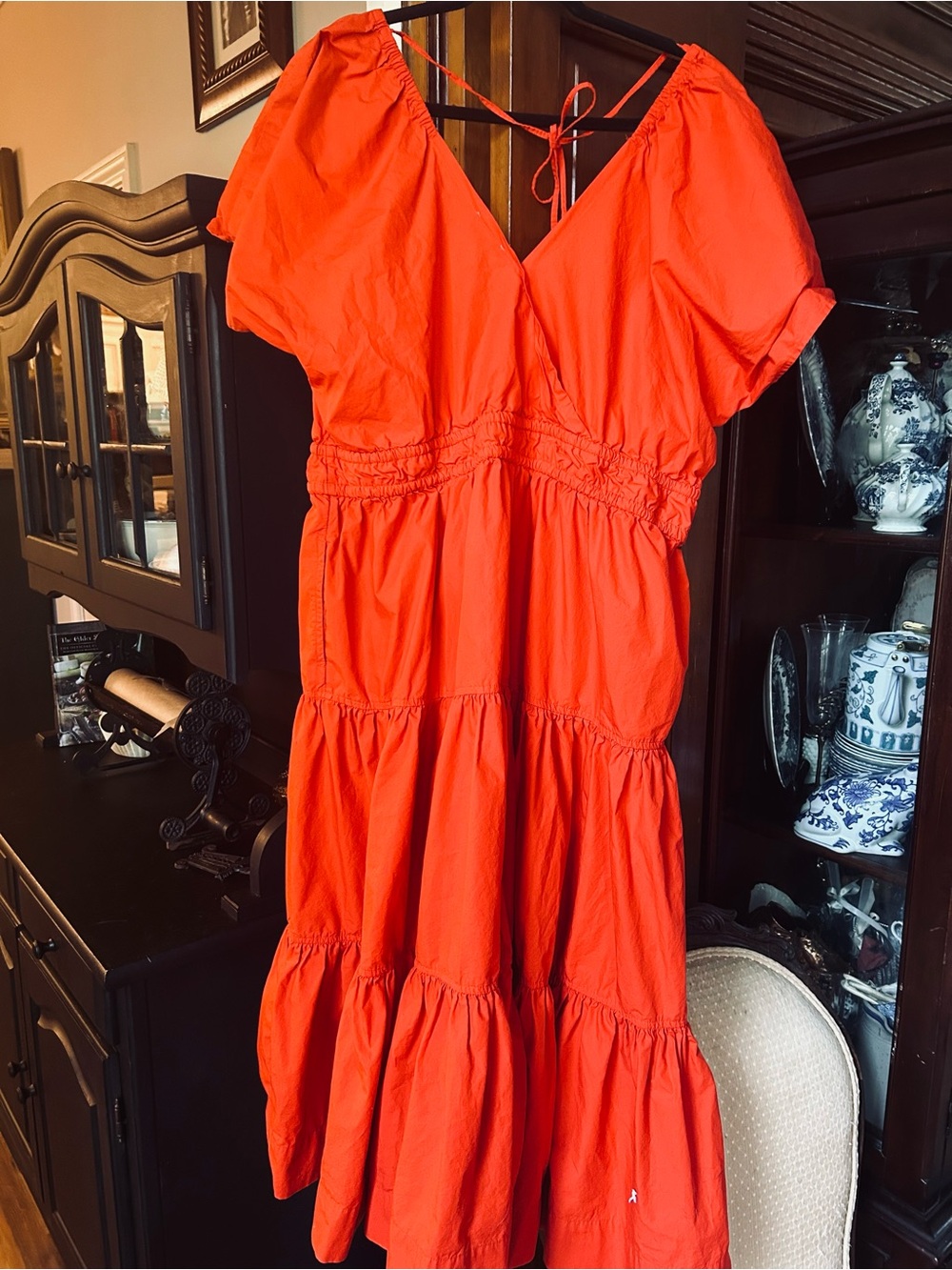 Woman’s Vibrant Orange Tiered Summer Dress with Puff Sleeves